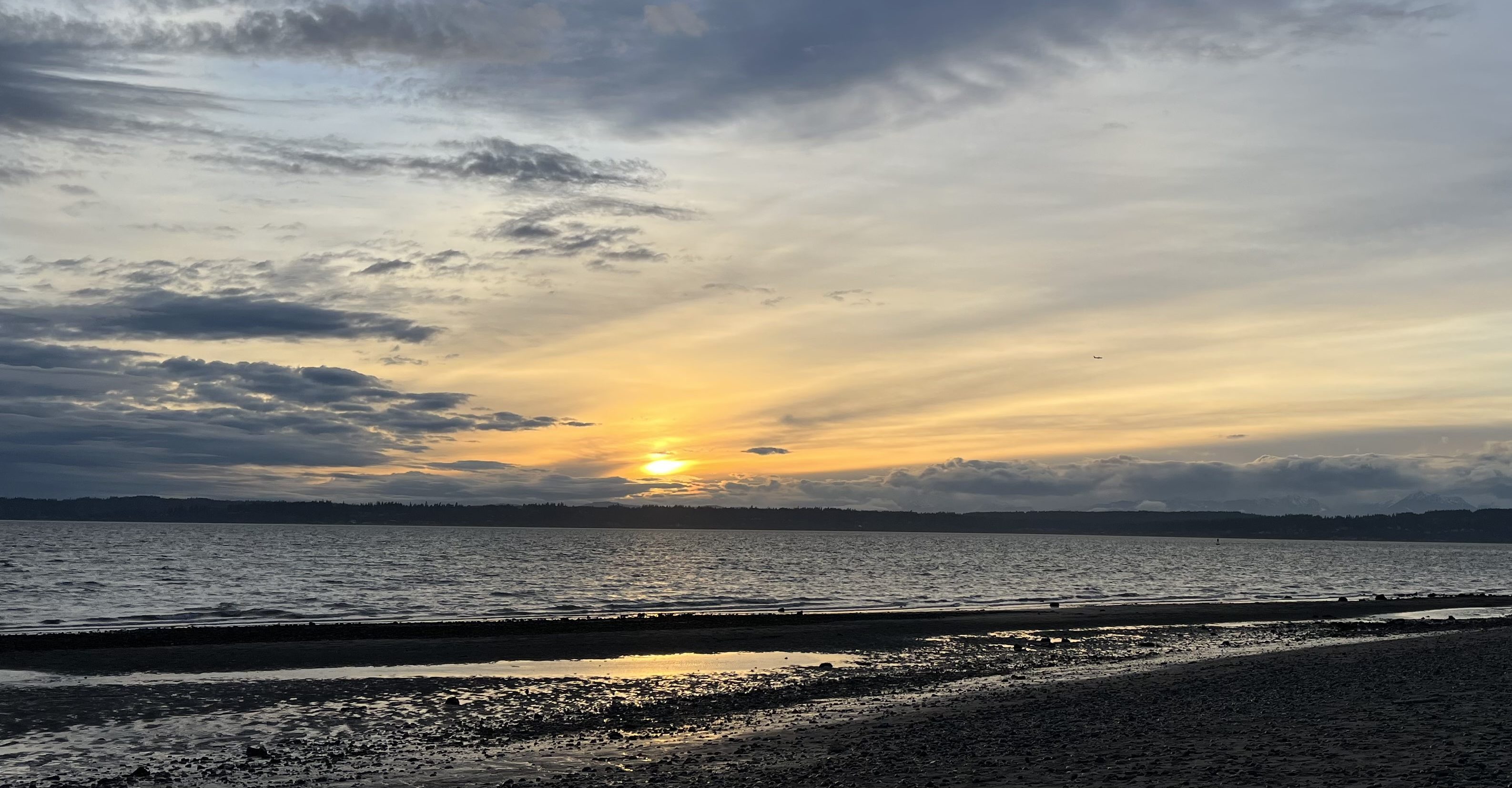 Photo of a cloudy sunset on a beach